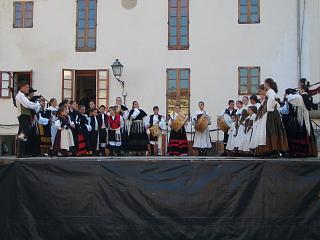 A stage with dancers and traditional instruments