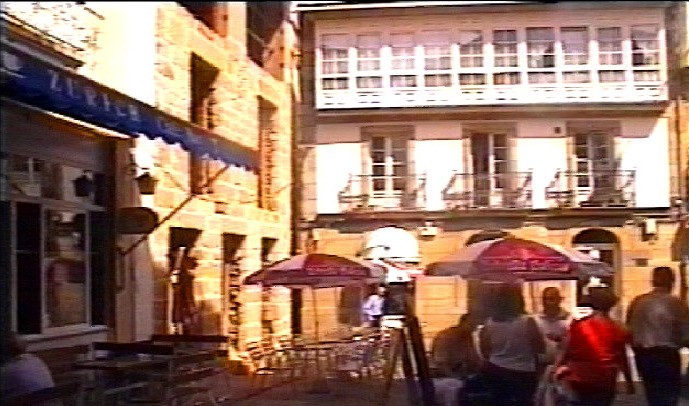 A street in the medieval quarter with bars either side