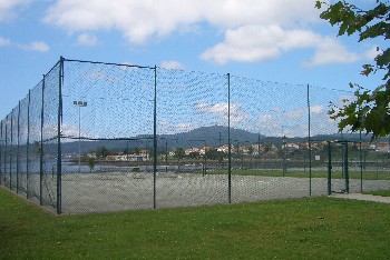 Tennis courts with bay beyond. The bars overlook these